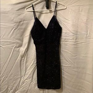 Midnight blue with silver thread details.